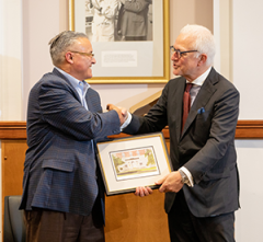 David Jones, MD, president of the Albany Medical College Alumni Association, presents the Distinguished Alumnus Award to Dr. Philip Stieg.