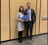 Dr. Jennifer Moliterno presents Rutka Award to Dr Evan Bander