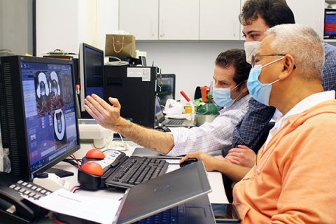 Inside the control room, the team manages the precise delivery of the beams